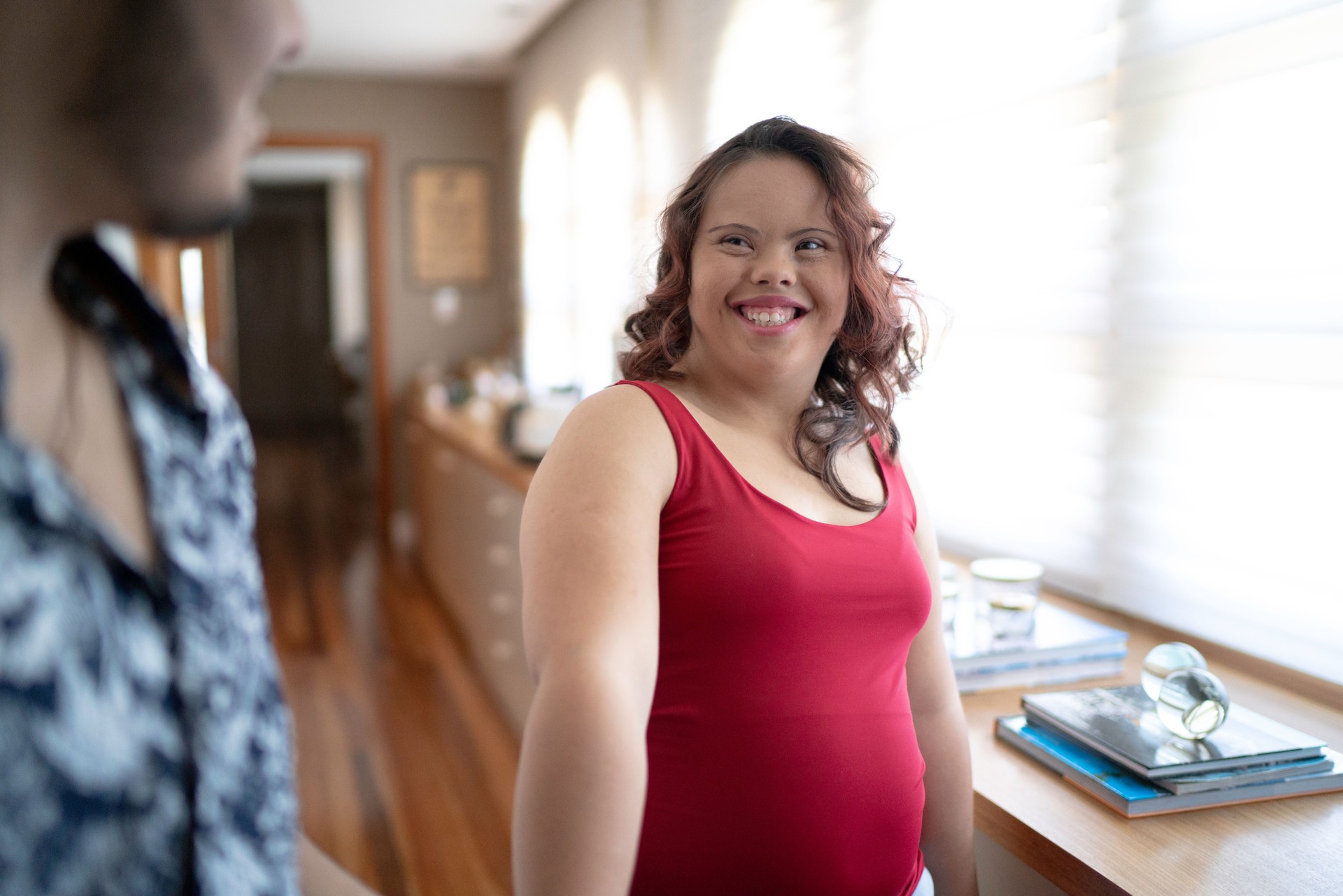 Special needs couple walking and talking inside the house